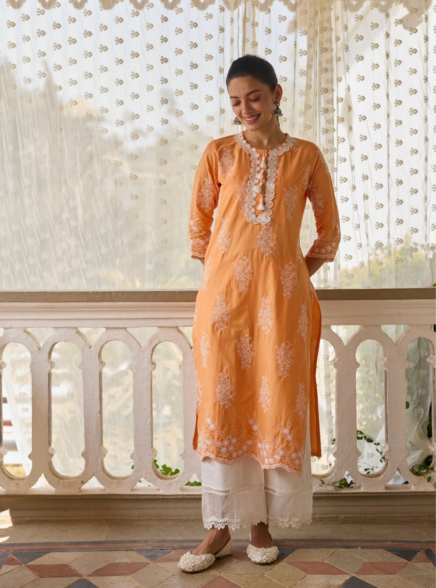 Perla Supima Cotton Orange Kurta with Floral Lace Flared White Pant Set